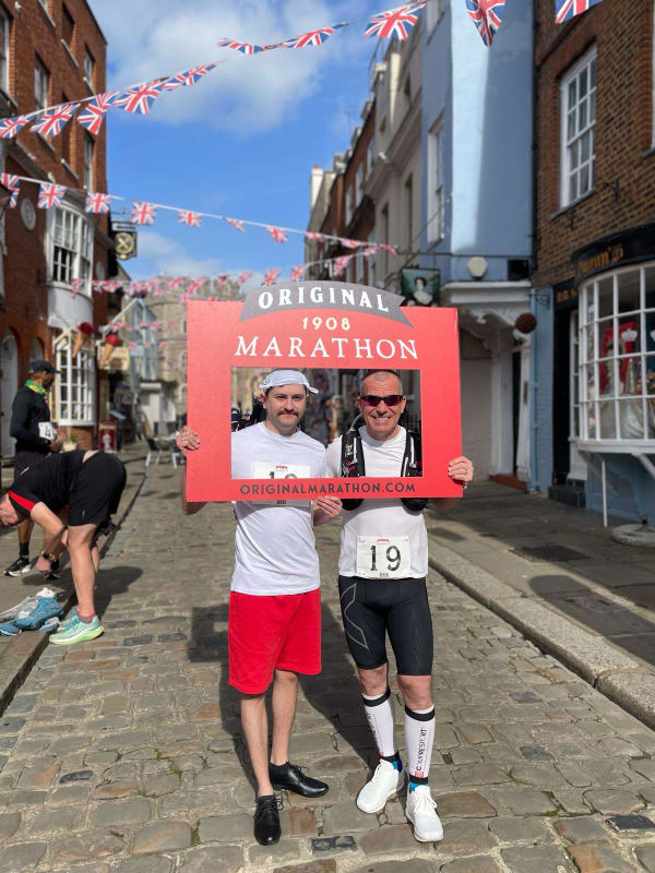 Brian with man dressed as an original marathon runner